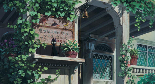 screencap from kiki's delivery service showing a cat sitting in front of entrance to a building surrounded by lush greenery
